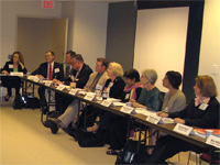 Meeting attendees listen in during group discussion.