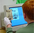 A student prepares a historic photograph to be uploaded into the Maine Memory Network.