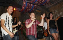 Photo of American Council of Young Political Leaders (ACYPL) Delegate Jon Russell singing in Manila, Philippines