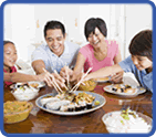 a family sitting down to dinner