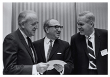 [Dr. Robert Q. Marston, Wilbur Cohen, and Dr. Hudson at a Regional Medical Programs meeting]. [ca. 1968-1973].