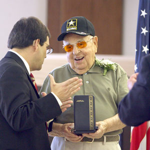 U.S. Rep. Gus Bilirakis, R-Palm Harbor, left, congratulates Frank Cello, 93, who waited 61 years for his Bronze Star, WWII Victory Medal, Combat Infantryman Badge and a WWII Honorable Service Pin. [Douglas R. Clifford | Times]