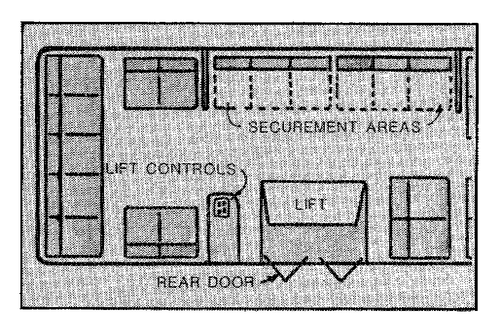 Figure shows the securement area as being directly across from the rear door lift on the bus.