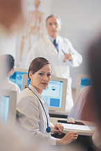 Female medical student in a classroom.