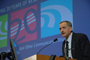 a photo of Dr. James Battey, Jr. speaking at a podium.