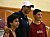 Photo of Carla embracing two Qatari boys after conducting a clinic