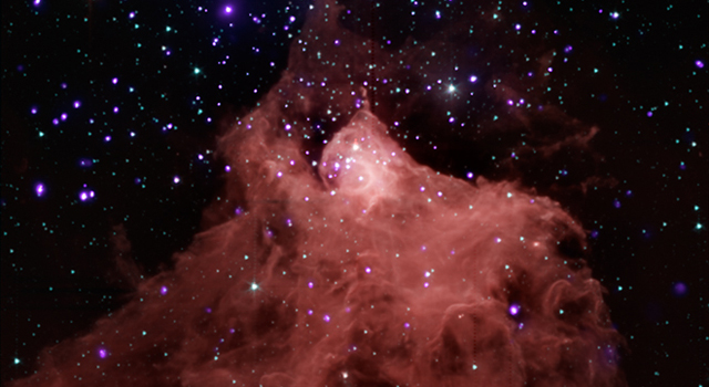 image combining data from NASA's Chandra X-ray Observatory and Spitzer Space Telescope shows the star-forming cloud Cepheus B