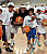Photo of Williams smiling with a group of Bahraini boys