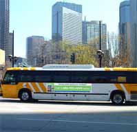 Photo of a bus driving through a city.