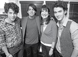 Image of the Jonas Brothers with Dr. Kaufman