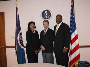 Charging Party Richard Quick (center) is pictured with Deputy Director Hollis Larkins (right) and Regional Attorney Delner Franklin-Thomas (left), after signing the Settlement Agreement.