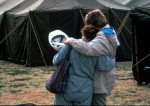 Two workers consoling each other