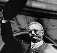 Portrait of Theodore Roosevelt waving his hat