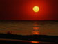 Image of the sun on the ocean's horizon.