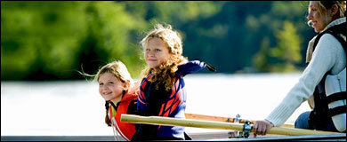 Photo: Mother and daughters in a boat