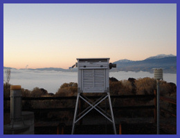 Instrument shelter with background valley fog