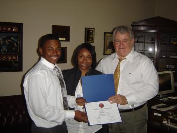 Congressman Brady presents an award to the 2009 Congressional Arts Competition winner.