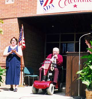 Photo: man using a scooter at Dickinson City Hall