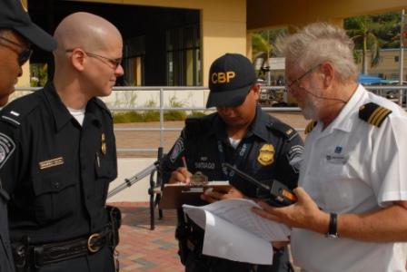 Cruise Line Safety Officer and U.S. Customs Agents discussing passenger accountability during Caribbean Mass Rescue Exercise, August 9, 2007, St. Thomas, U.S. Virgin Islands