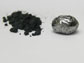 UCLA scientists have made rhenium diboride, an “ultra-hard material.” Rhenium diboride is seen here in powder form (left), made from heating the elements in a furnace, and as a pellet made by a procedure called arc melting