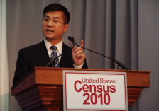 Locke at podium with 2010 Census logo.