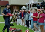 A MSST crewman talks to a group of schoolchildren