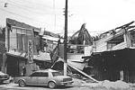 Collapse roof and upper story of a building due to load of wet ash 15-20 cm thick in Castilleejos, Philppines