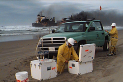 OR&R personnel unpack response equipment on the beach.