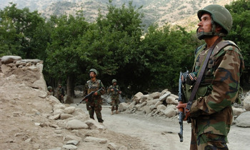Afghan National Army soldiers patrol the Wadawu valley of Nuristan province. President Obama's Afghanistan-Pakistan strategy calls for boosting numbers among the Afghan army and police forces.