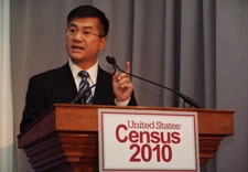 Locke speaking before audience with Census 2010 logo.