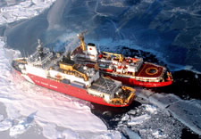 Image of U.S. and Canada Coast Guard icebreakers side by side. Click for larger image.