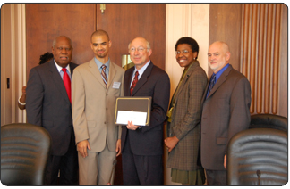 Deputy Assitant Secretary Robert Stanton and Secretary Salazar congratulate Joshua P. Sommerville of Gaithersburg High School and his parents on his scholarship. (Photo credit: Tami A. Heilemann-DOI)