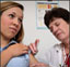 Image of lady getting a vaccine