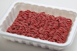 Ground beef in a white container.