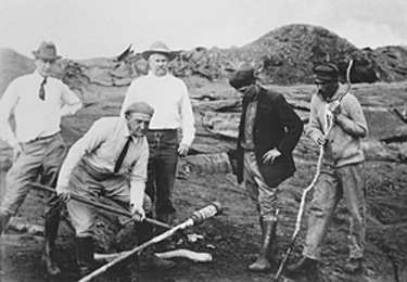 Thomas Jaggar (second from left) prepares to measure the temperature of the Halema`uma`u lava lake in 1917.  Pictured, left to right, Norton Twigg-Smith, Thomas Jaggar, Lorrin Thurston, Joe Monez, and Alex Lancaster.