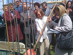 USAID/Kosovo Mission Director Patricia Rader pours concrete for the foundation of the new Iliria school annex.