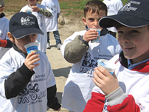 Children enjoy tasting local yogurt during a visit to the Eurolona dairy farm.