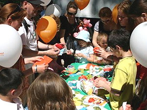 Children and adults make crafts at a festival in Moscow promoting NGOs, volunteerism and inclusion of children with disabilities.