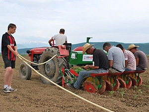 A $10,000 planting machine donated by USAID to the Perdrini Fruit and Vegetable Association requires only six people to do work that had previously required 24 laborers.