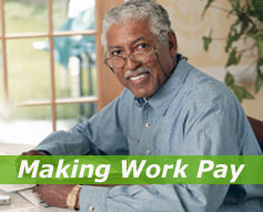 Man working at table - "Making Work Pay"