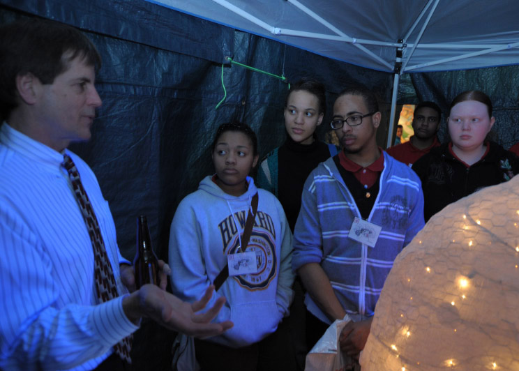 Dr. Dennis Twombly of NIAAA shows kids the “Drunken Brain” tent. 