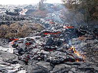 Scattered surface flows continued to be active on the pali in Royal Gardens subdivision.  This flow was fed by a small, steep channel in the upper left of the photograph.  Portions of the flow were invading adjacent forest, sparking small fires.    