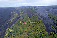 Lava breakouts have been active over the past week on the west side of the TEB flow field in the upper part of Royal Gardens. These are the lightest-colored flows in the upper right quadrant of the photo. A deflation/inflation cycle (DI event) at Kīlauea's summit overnight resulted in a slow-down in activity on the flow field, so there was only minor surface activity today. The flows are coming down to the east of the last occasionally-occupied house in the subdivision (the red-roofed structure in the photo).