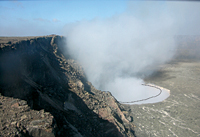 A comparison of photos from before and after the collapses, taken by a time-lapse camera positioned on the NE rim of Halema`uma`u Crater, show considerable expansion of the vent opening. The black line in this image shows the shape of the vent rim a few days before the collapses. The vent is now 123 meters (404 feet) wide from this perspective, having increased by 23 meters (75 feet).