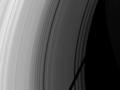 The shadow of the moon Tethys cuts across Saturn's rings
