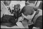 Man working sewing machine in garment factory