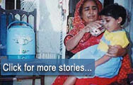 Pakistan - A mother gives her child treated water to reduce the risk of disease  ...  Click for more stories...