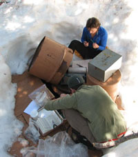 USGS ecologist Jill Baron and field technician Austin Krcmarik prepare a stream gage.