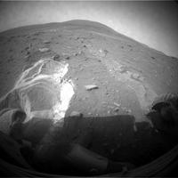 Spirit took this image with its front hazard-avoidance camera on Sol 1899. With Spirit in the position shown here, the rover team temporarily suspended driving attempts while studying the ground around Spirit and planning simulation tests of driving options with a test rover at NASA's Jet Propulsion Laboratory in Pasadena, Calif. 