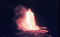 Lava pours from base of lava fountain across lava lake, Kilauea Iki Crater